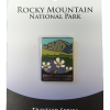 traveler pin Enamel pin showcasing mountains and flowers labeled "Rocky Mountain National Park," mounted on a card reading "Traveler Series Enamel Pin." Product: Pin - RMNP Traveler Series.
