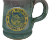 Green ceramic mug titled "Deneen RMNP Pika" highlighting a Rocky Mountain National Park emblem with a pika illustration.