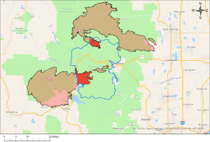 Map showing various fire perimeters in Colorado, with areas highlighted in brown, red, and pink near Fort Collins, Loveland, and Boulder. Major roads and cities are labeled.