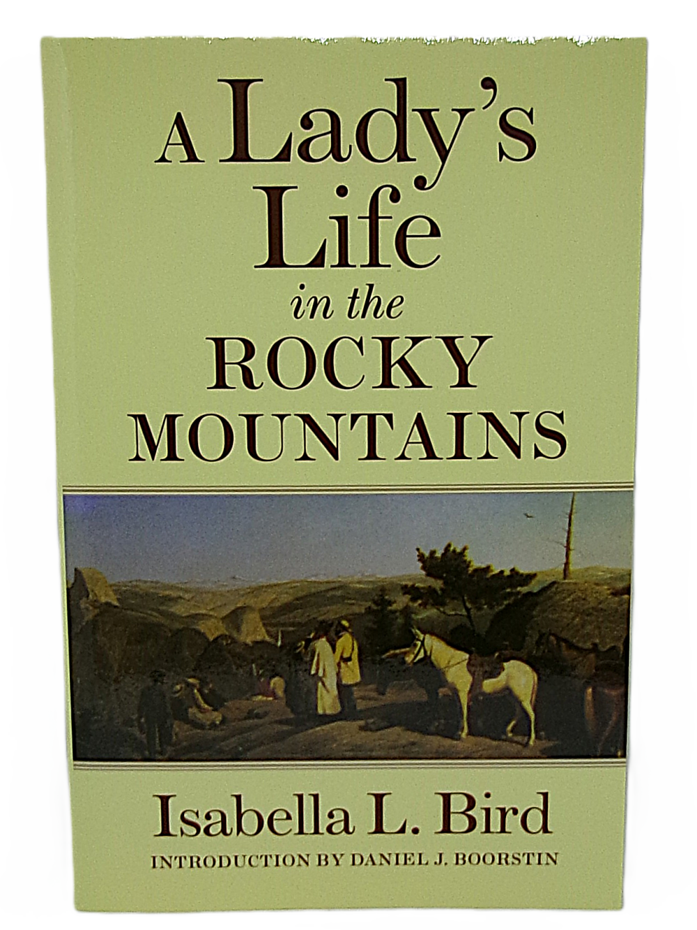 ladys life The cover of "A Lady’s Life in the Rocky Mountains" features a painting with people and horses in a rocky landscape.