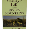 ladys life The cover of "A Lady’s Life in the Rocky Mountains" features a painting with people and horses in a rocky landscape.