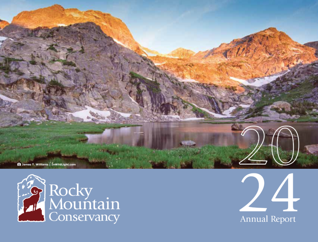 Mountain landscape with snow patches reflected in a calm lake at sunset; "Rocky Mountain Conservancy 2024 Annual Report" text on a blue banner at the bottom.
