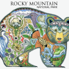 The Mug - RMNP Bear Collage features a bear silhouette filled with intricate images of animals, birds, and plants inspired by Rocky Mountain National Park.
