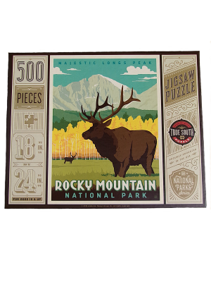 A 500-piece puzzle named "Puzzle - Fall Bull Elk," showing an elk before mountains and trees, labeled Rocky Mountain National Park; finished size measures 18 x 24 inches.
