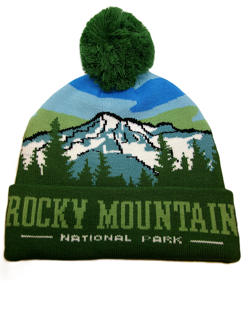 The Snowy Mountains Beanie is a green knit hat with a pom-pom, featuring a mountain and forest design plus "Rocky Mountain National Park" on the front cuff.