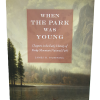 when the park was young front Front cover of "When the Park Was Young: Chapters in the Early History of Rocky Mountain National Park" by James H. Pickering, featuring a landscape painting with deer by a lake and mountains in the background.