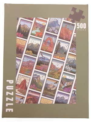 The "Puzzle - Images of the National Parks" is a 500-piece box featuring colorful illustrations of different natural landscapes arranged in a grid pattern on the front.