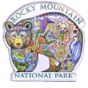 Magnet shaped like a bear, featuring a colorful collage of animals, plants, and scenery with the text "Rocky Mountain National Park.