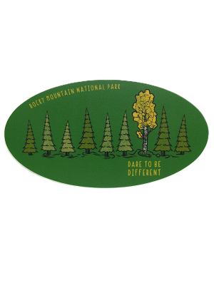 The Sticker - RMNP Dare to be Different features an oval green design with pine trees, one yellow tree, and the text "ROCKY MOUNTAIN NATIONAL PARK" and "DARE TO BE DIFFERENT.