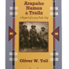 names and trails front Book cover of "Arapaho Names & Trails: A Report of a 1914 Pack Trip" features a sepia photo of three people in outdoor attire with geometric border designs.