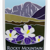 Sticker-RMNP Longs Peak Columbines features an illustrated Rocky Mountain National Park sign with purple and white columbine flowers in the foreground and stylized Longs Peak mountains in the background.