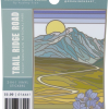 trr 2 in 1 sticker Sticker - Trail Ridge Road 2-in-1: Illustrated sticker showcasing Trail Ridge Road in Rocky Mountain National Park, with a winding road, mountains, sun, and purple flowers; product info is included on the packaging.