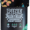 bandana river run A folded black bandana featuring a colorful print, wrapped in a Pine Print Shop label that notes it is made in the USA with water-based inks and crafted from 100% cotton.