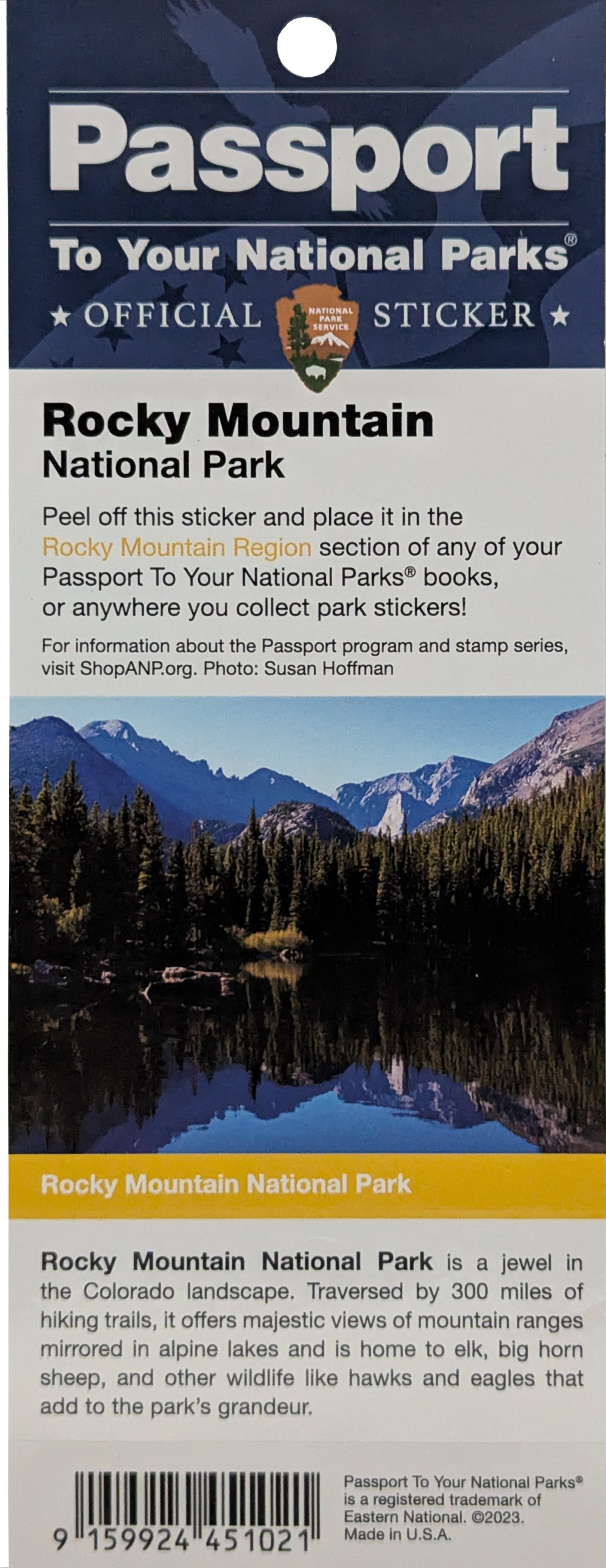 passport stamp sticker 014967 final Sticker - RMNP Passport Stamp New, showcasing Rocky Mountain National Park with a lake, forest, and snow-capped mountains beneath a blue sky, along with informational text about the park and the passport sticker program.